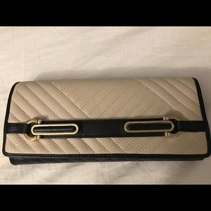 Cream and black clutch bag